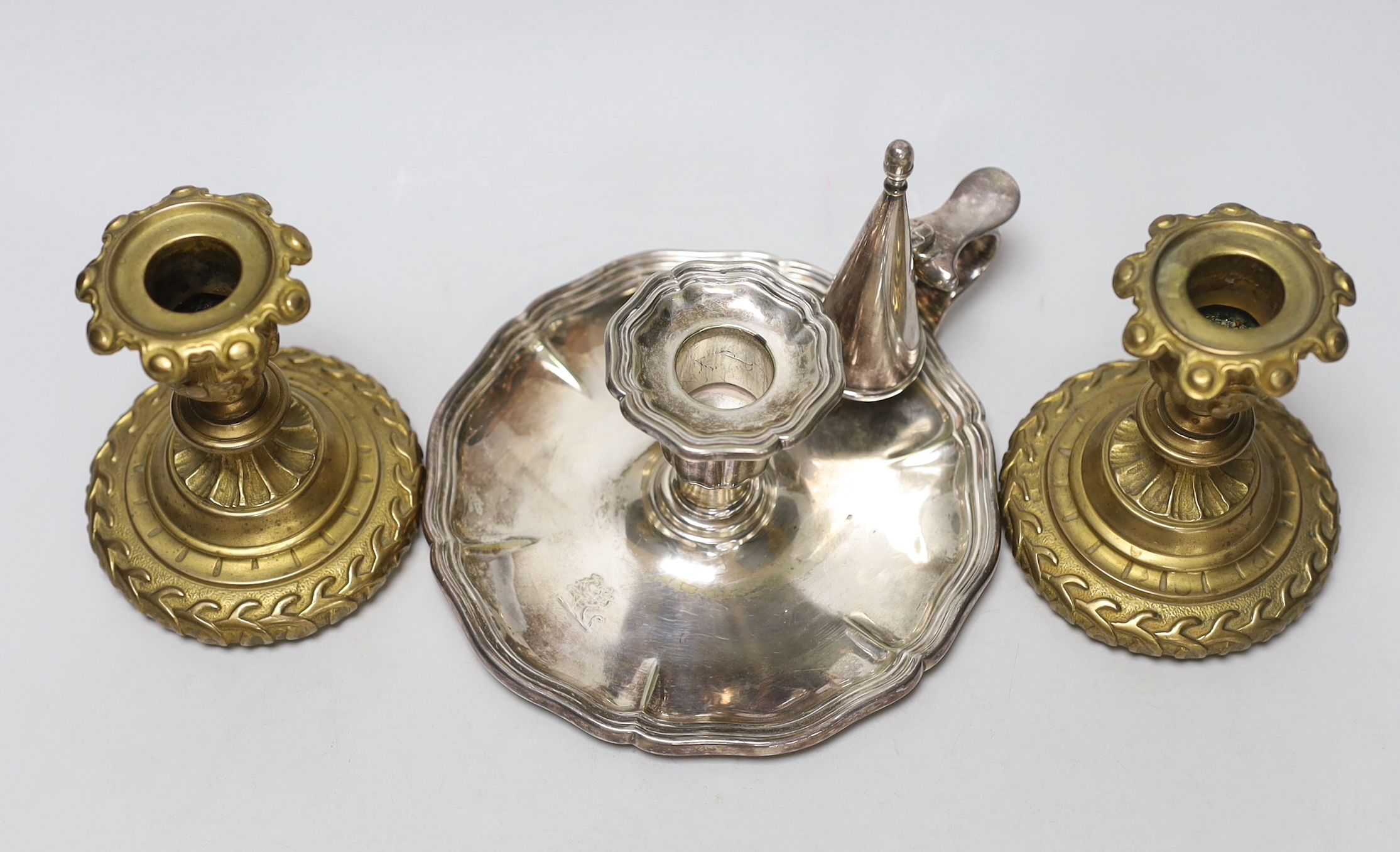 A pair of 19th century brass candlesticks and a plated chamberstick and snuffer, impressed 1611 to the base, largest 11cm high